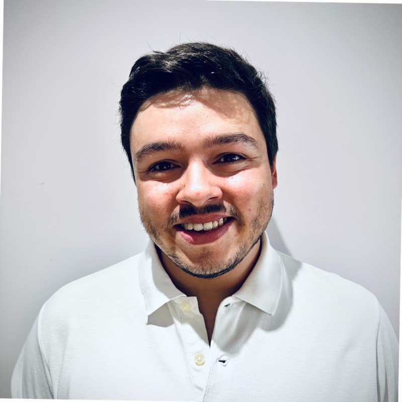Diogo, Cardinal Studio's founder — frontal portrait, neutral background, white polo.